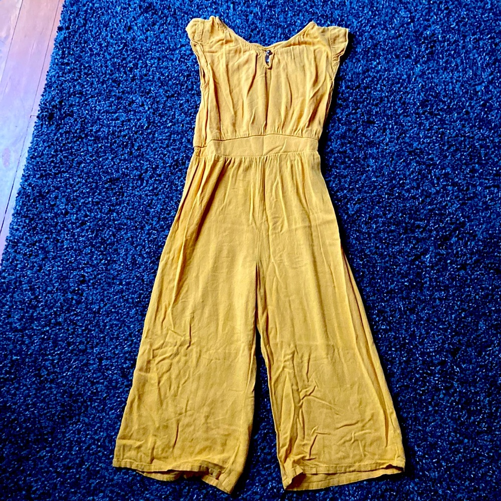 I am selling a romper from Old Navy in yellow with a front button.